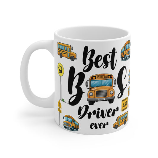 A white ceramic mug featuring a colorful school bus safety theme. The design includes bright yellow school buses, red stop signs, "Slow Down" signs, a 10-speed limit sign, and pedestrian crossing symbols. The playful pattern combines road safety elements with cartoon-style illustrations of school buses, creating a vibrant and educational design.
