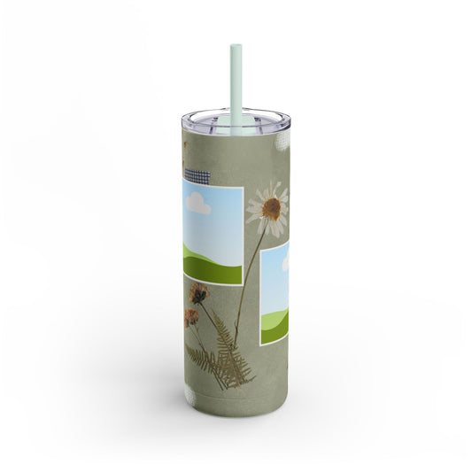 A set of three stainless steel tumblers with reusable straws and clear lids. The design features an earthy green background accented with subtle white paintbrush strokes. Each tumbler includes placeholders for scenic photos with green hills and blue skies. Hand-drawn wildflowers, daisies, and delicate ferns add a natural, rustic charm, while one tumbler features the uplifting phrase "Today is a good day" in elegant script. The design evokes a serene, nature-inspired theme perfect for personalization.