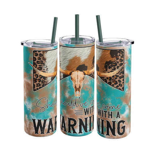 Bold 20oz sublimation tumbler featuring a rustic longhorn skull, turquoise and brown distressed background, and leopard print accents with the phrase 'Should've Come with a Warning.' Perfect for country and western enthusiasts, this double-walled tumbler keeps drinks hot or cold and includes a reusable straw for eco-friendly hydration.