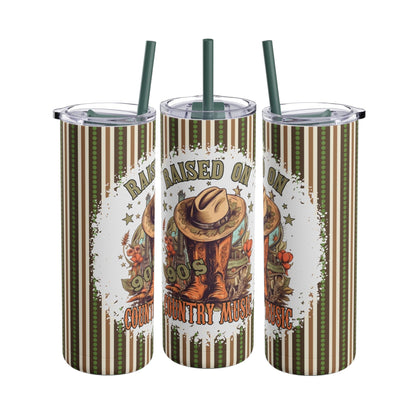Retro-inspired 20oz sublimation tumbler featuring the nostalgic phrase 'Raised on 90s Country Music' with cowboy boots, a hat, and rustic accents. Designed with earthy tones and stripes, this double-walled tumbler keeps drinks hot or cold and includes a reusable straw, perfect for country music fans and vintage lovers.