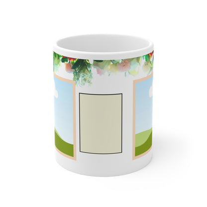 A white ceramic mug featuring a colorful floral design at the top, with vibrant pink, green, and orange flowers. The design includes a placeholder photo frame with a scenic illustration of green hills under a blue sky with a white cloud, bordered in soft peach. The floral elements give the mug a fresh, lively, and personalized touch, ideal for showcasing a favorite photo.