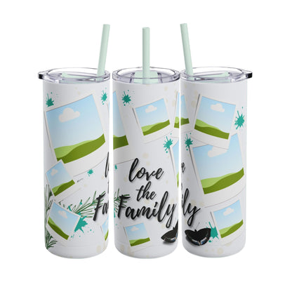 A set of three stainless steel tumblers with reusable straws and clear lids. The design features placeholders for family photos, surrounded by scenic green hills, blue skies, and whimsical elements like snowflakes and greenery. The central tumbler displays the phrase "Love the Family" in elegant, bold black script, complemented by soft decorative accents like leaves and abstract dots, creating a warm and family-oriented theme.
