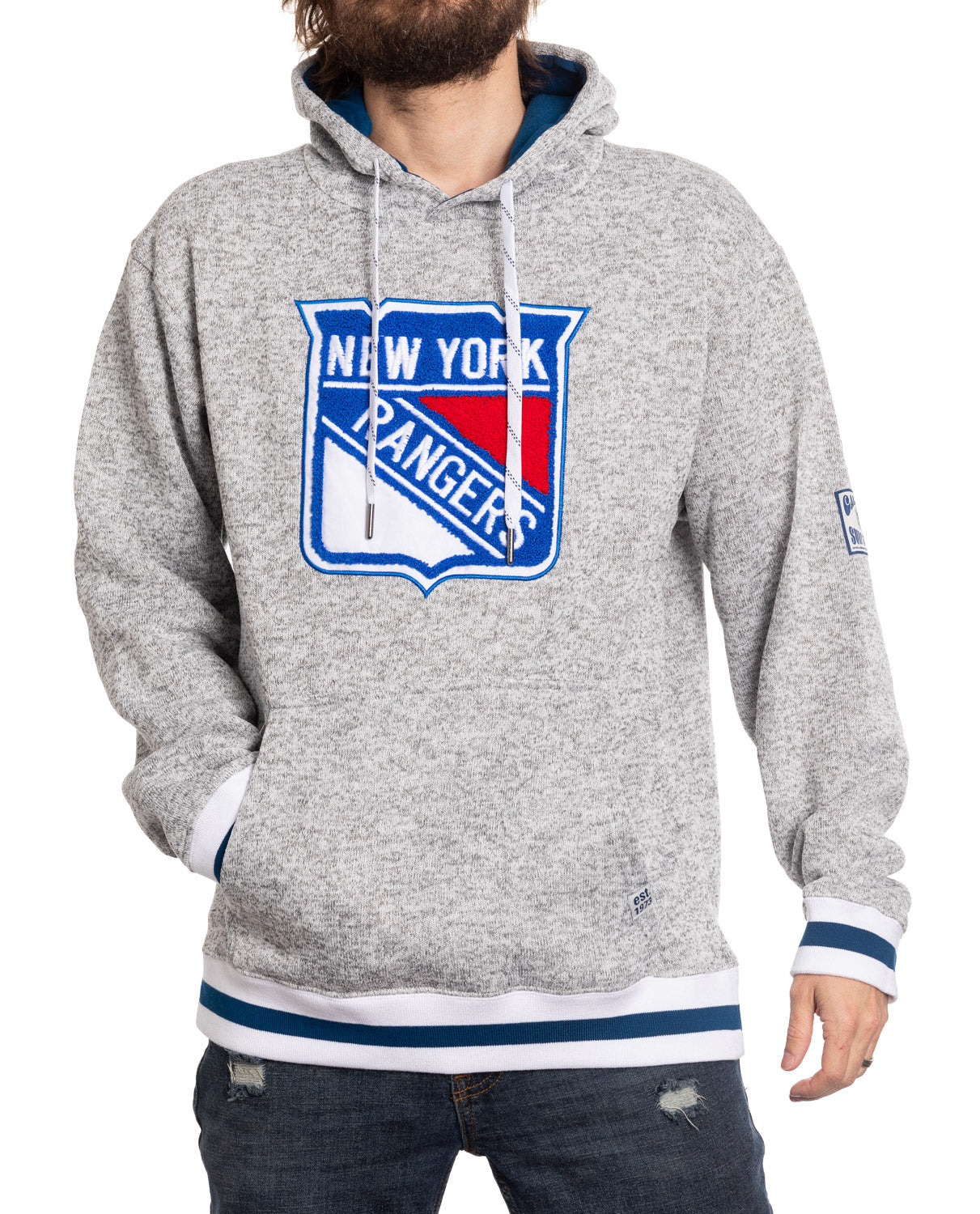 Person wearing a gray hoodie with New York Rangers logo on a white background