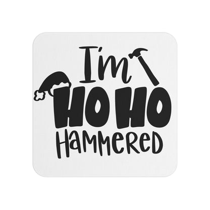 Funny Christmas coaster featuring the text 'I'm Ho Ho Hammered' in bold black font with a Santa hat and hammer graphic. A humorous addition to holiday parties, gifts, and festive home decor